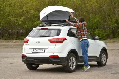 Автобокс на крышу Белый Turino 1 Аэродинамический 410л от интернет-магазина AUTOBOKS.kz. 