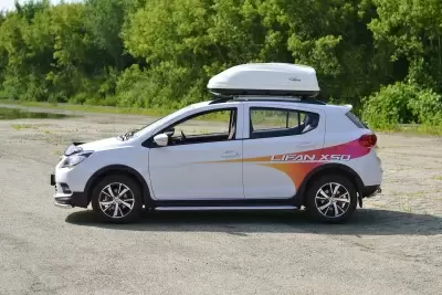 Автобокс на крышу Белый Turino Compact Аэродинамический от интернет-магазина AUTOBOKS.kz. 