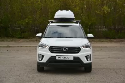 Автобокс на крышу Белый Turino 1 Аэродинамический 410л от интернет-магазина AUTOBOKS.kz. 