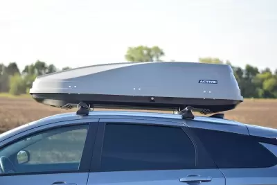 Автобокс на крышу PT-Group Аэродинамический "ACTIVE М" Серый ДВУСТОРОННЕЕ открывание от интернет-магазина AUTOBOKS.kz. 